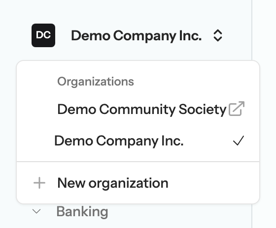The organization switcher menu open at the top of the sidebar, listing Demo Company Inc. with a check mark, Demo Community Society with an open-in-new-tab icon, and a New organization link